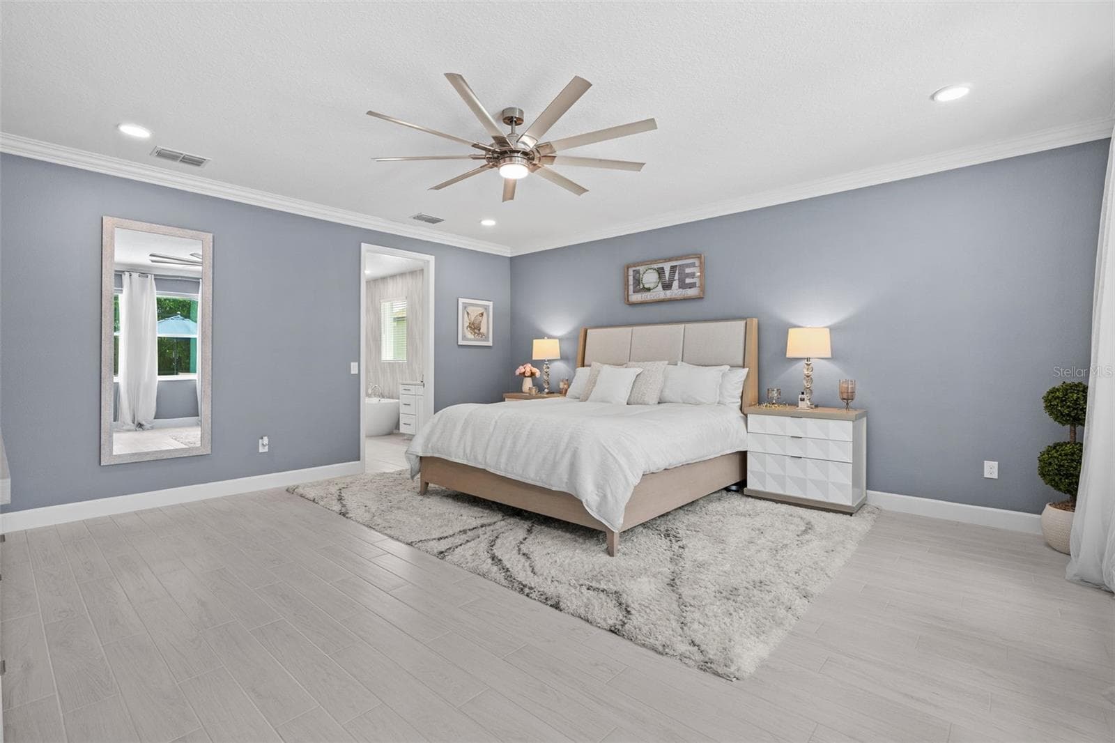 Generous main floor primary suite will quickly become your tranquil retreat. - 3336 LONE CYPRESS PT, OVIEDO