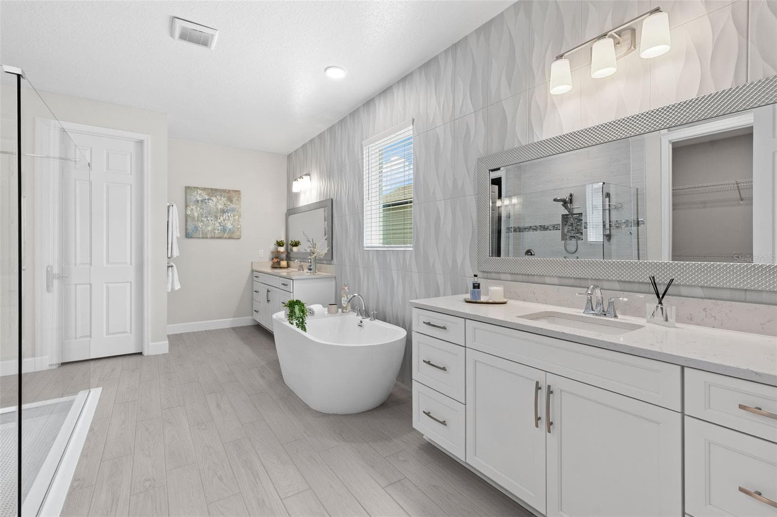 Spa-inspired primary en-suite bath. - 3336 LONE CYPRESS PT, OVIEDO