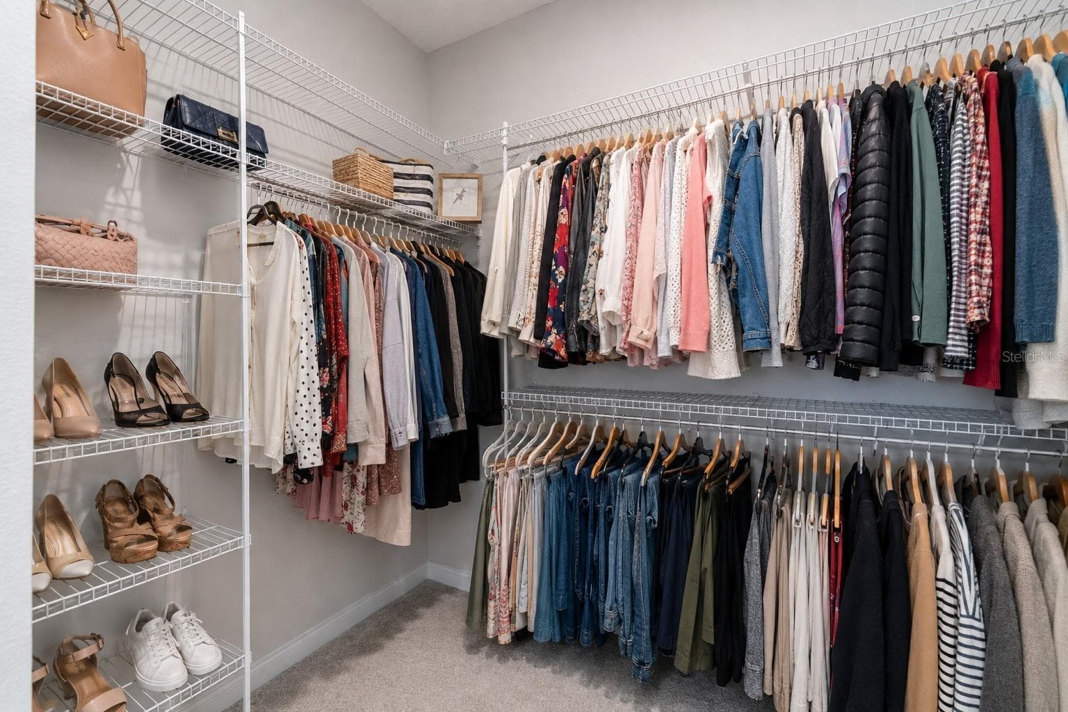 One of two identical walk-in closets in the primary suite. - 3336 LONE CYPRESS PT, OVIEDO