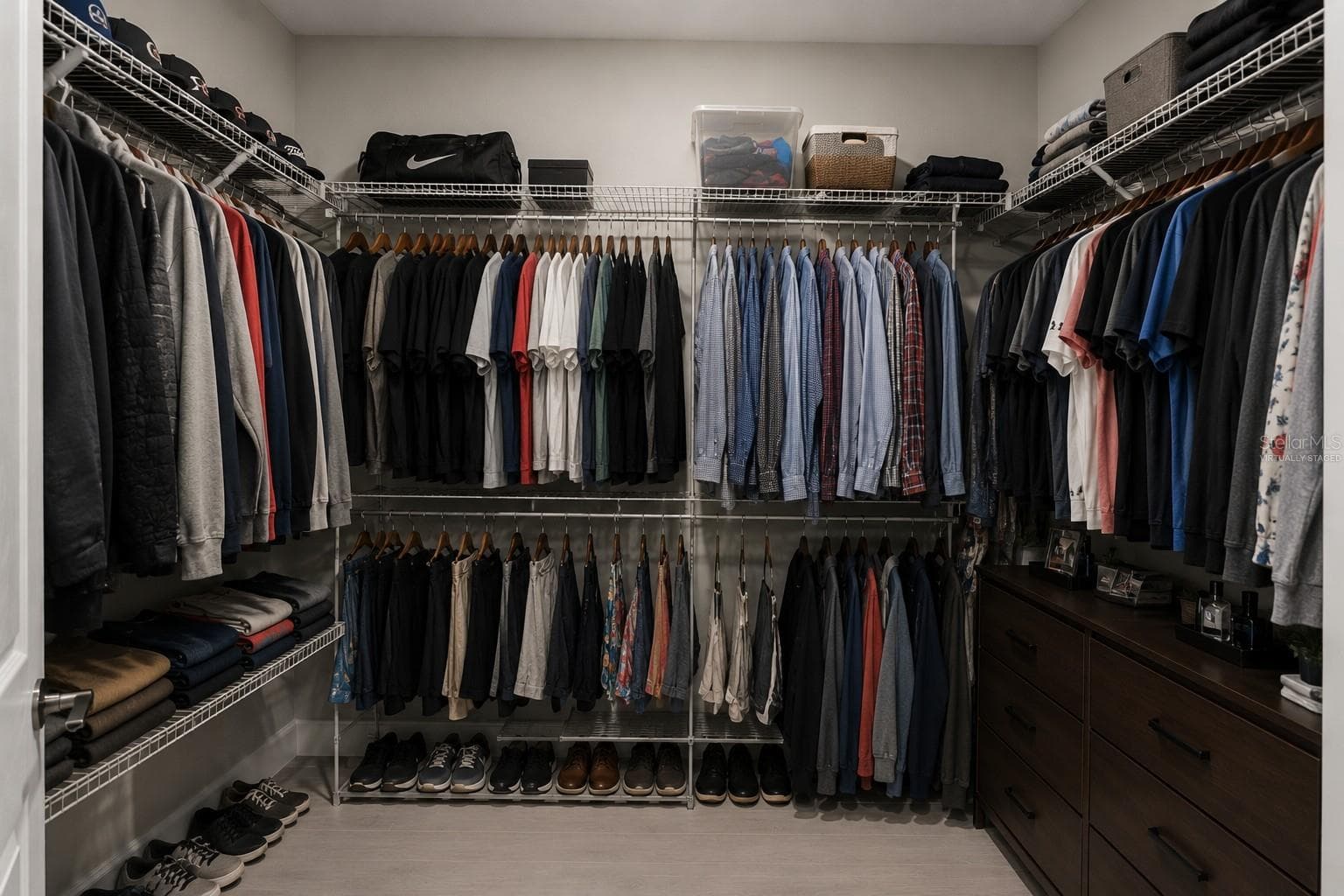 One of two identical walk-in closets in the primary suite. Virtually Staged. - 3336 LONE CYPRESS PT, OVIEDO