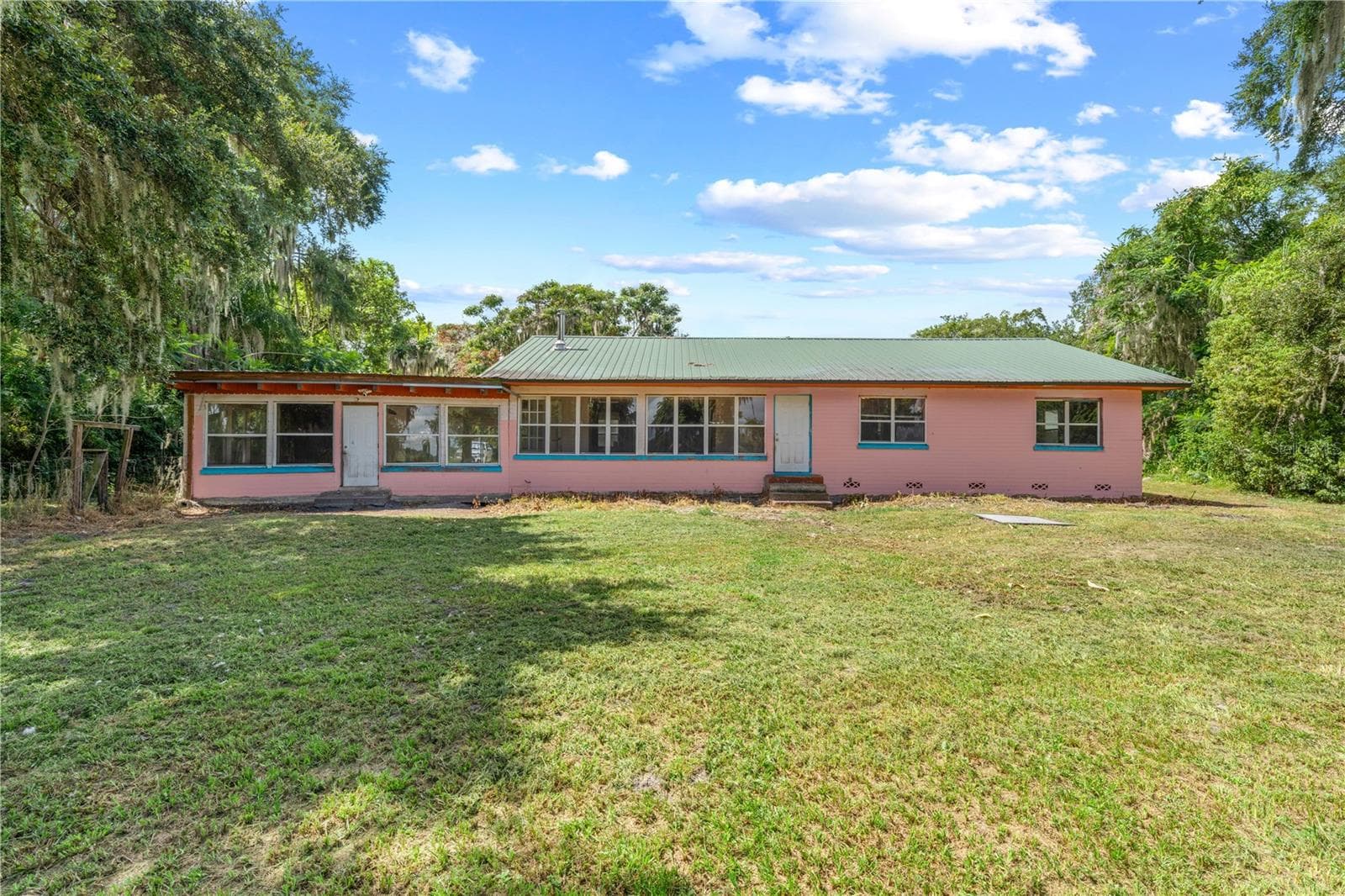 Front Exterior of the home facing the lake - 2557 AMES HAVEN RD, KISSIMMEE