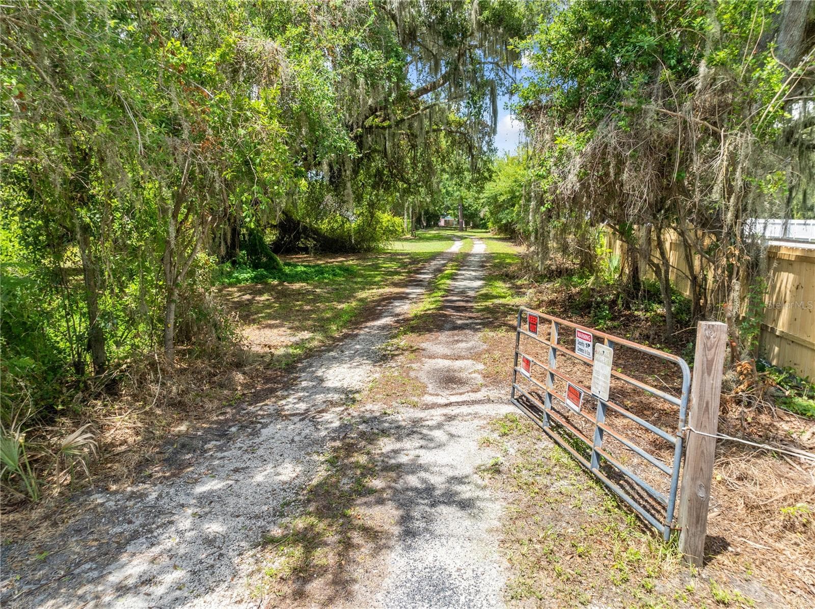 Gated entrance of the property. - 2557 AMES HAVEN RD, KISSIMMEE