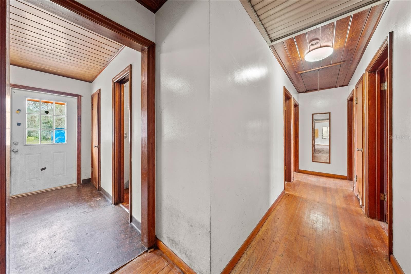 View of the back door and hallway leading to the bedrooms. - 2557 AMES HAVEN RD, KISSIMMEE