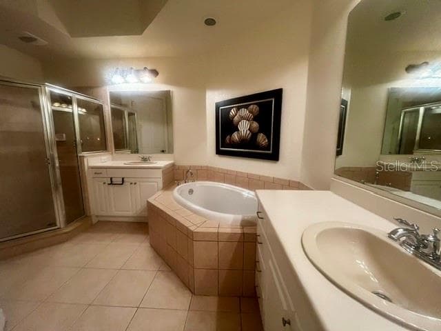 Primary en-suite bath features double vanities, garden tub and separate shower. - 98 VIVANTE BLVD #9834, PUNTA GORDA