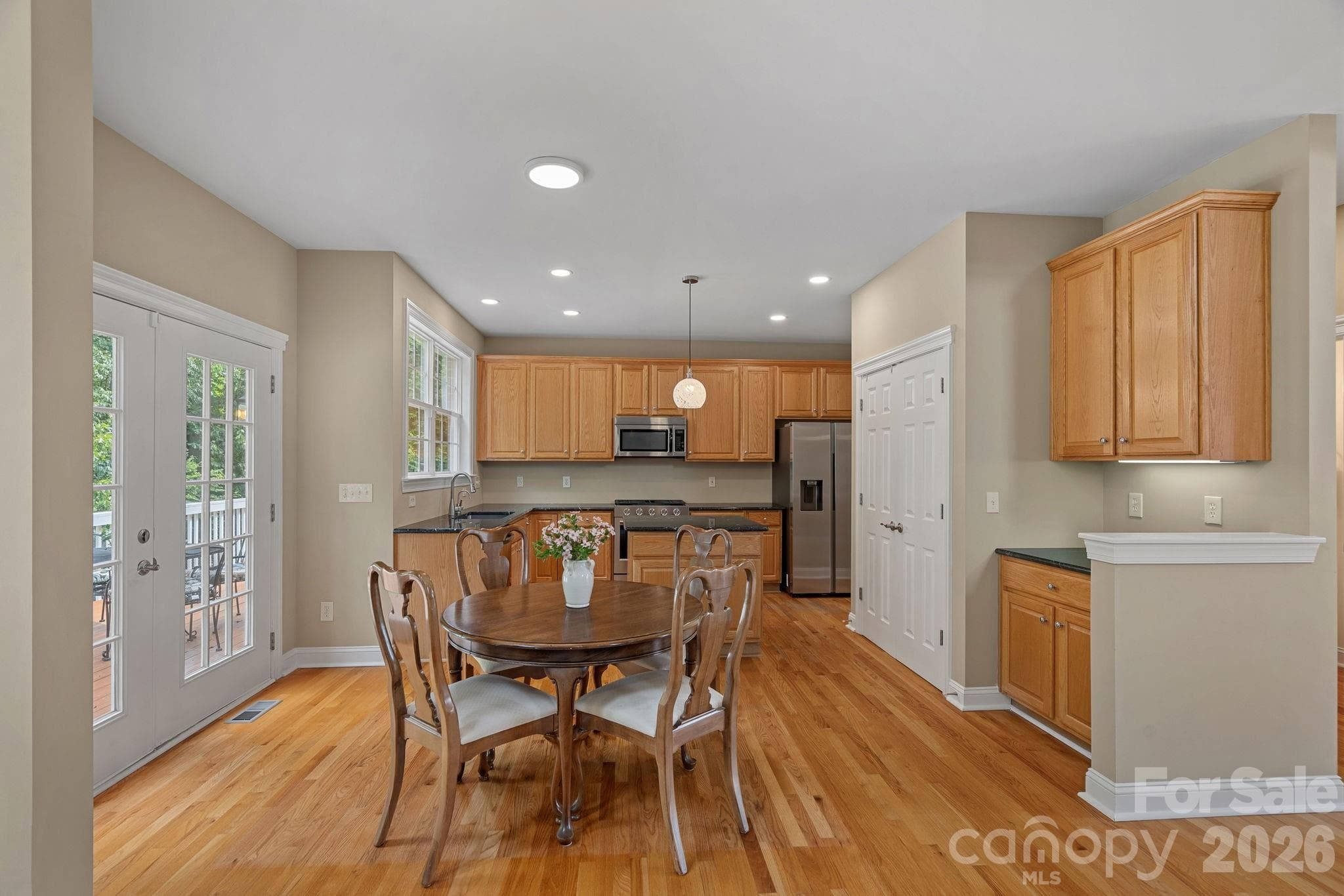 View of kitchen and breakfast area featuring the spacious pantry and extra cabinet feature/maybe wetbar-coffee bar. - Huntersville