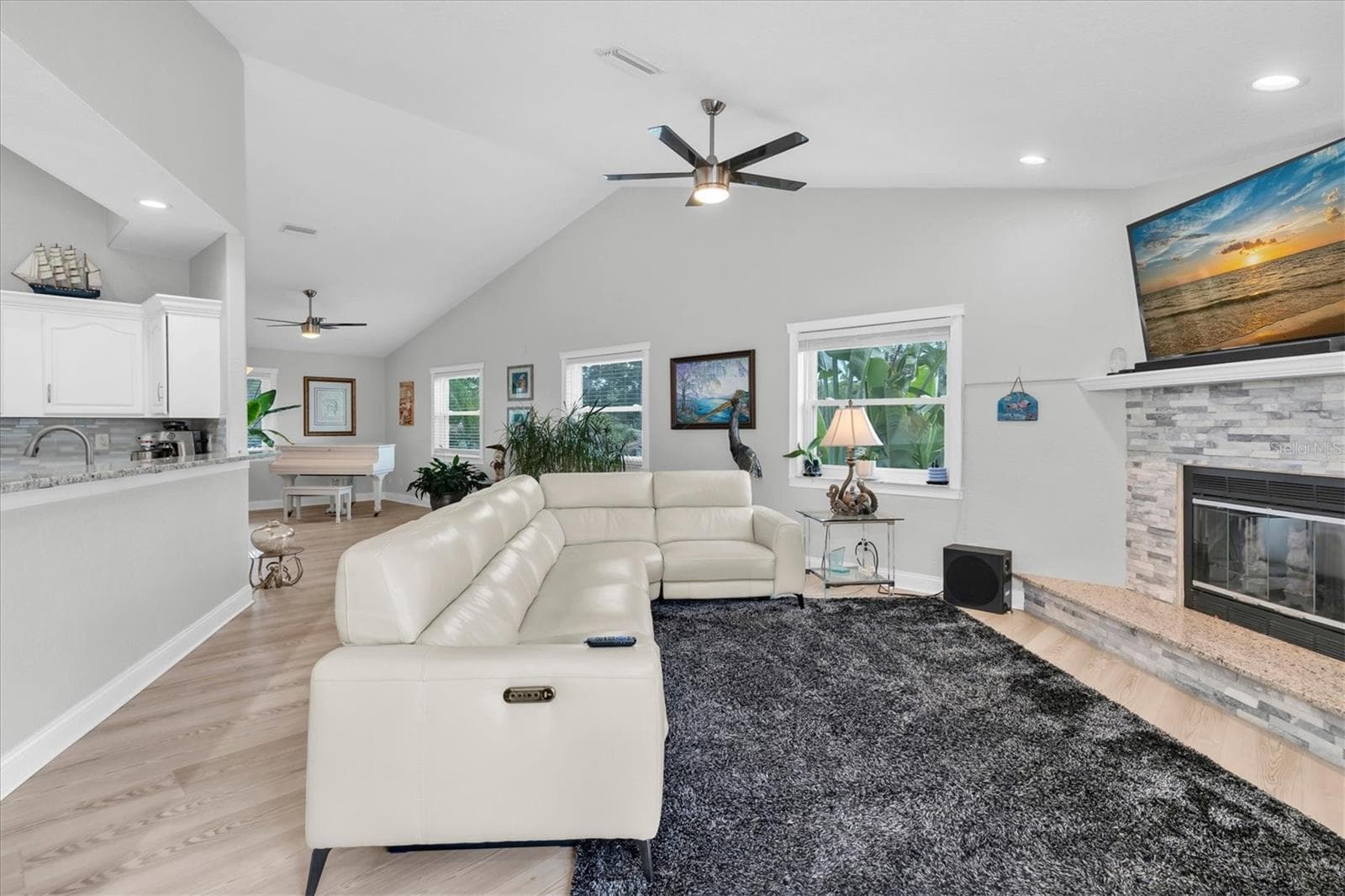 The spacious living & dining areas flow seamlessly into the family room, creating an inviting and open setting for everyday living and entertaining. - 6501 MOCKINGBIRD WAY S, GULFPORT