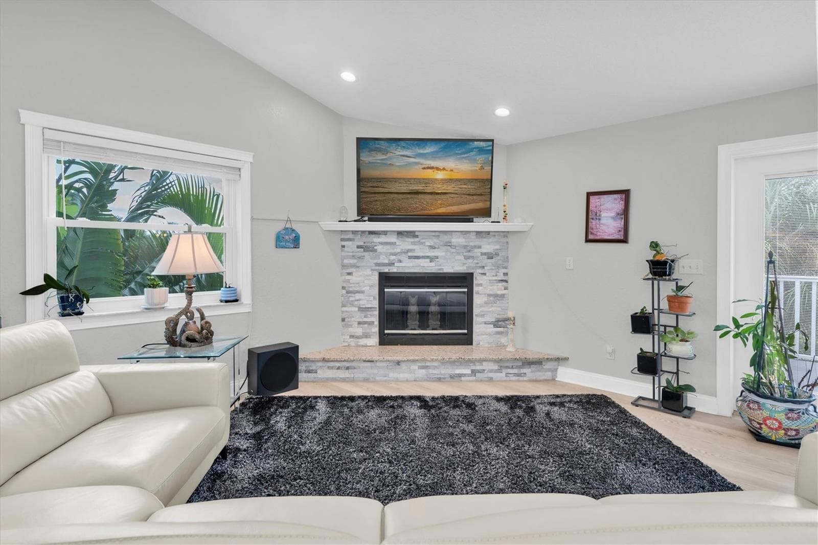 A beautiful wood-burning fireplace adds warmth, charm & character to the family room; perfect for cozy winter evenings. - 6501 MOCKINGBIRD WAY S, GULFPORT