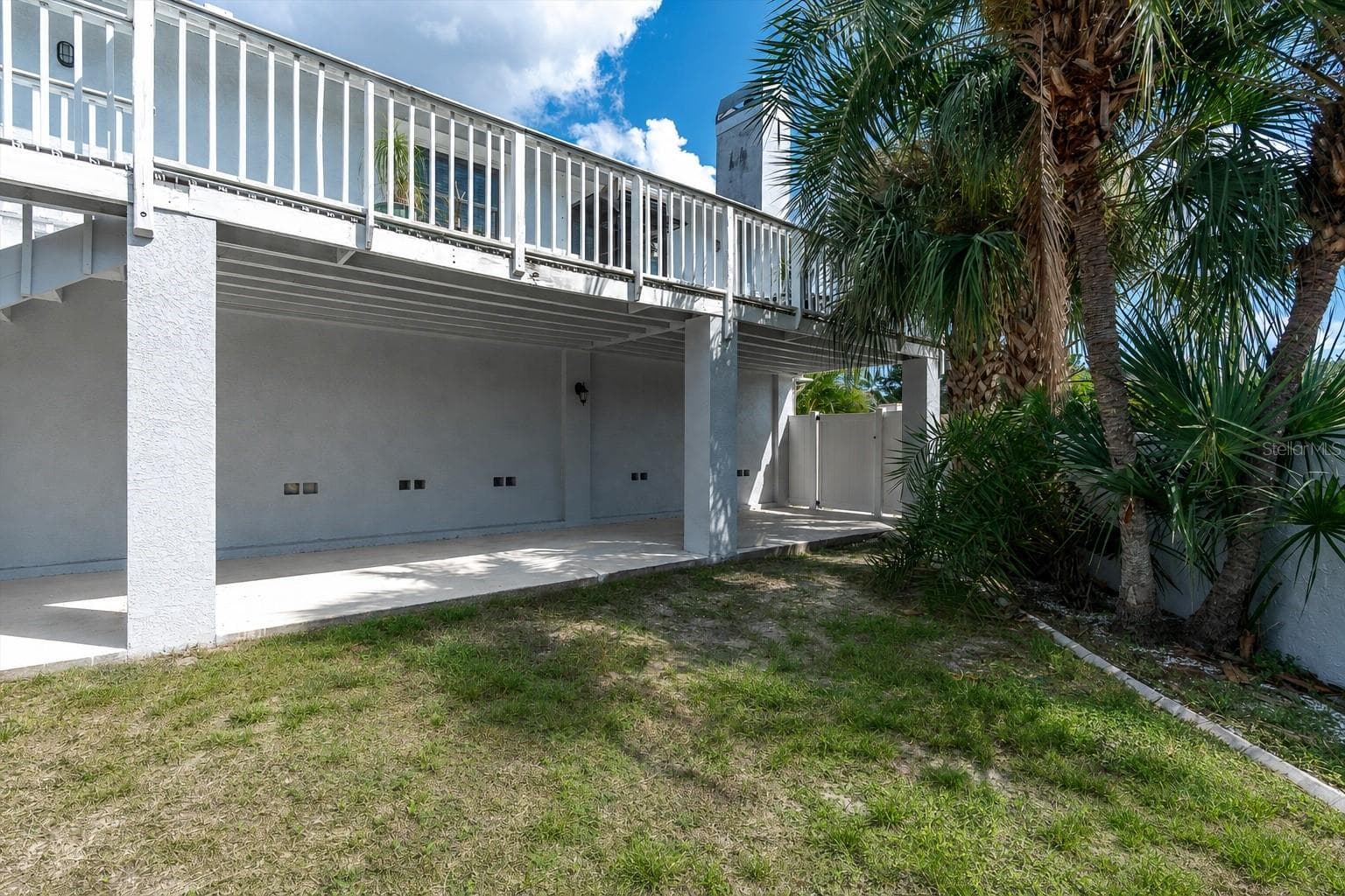 Beyond the pool, additional backyard space provides even more room for outdoor entertaining, recreation, gardening or simply enjoying the tropical surroundings. - 6501 MOCKINGBIRD WAY S, GULFPORT