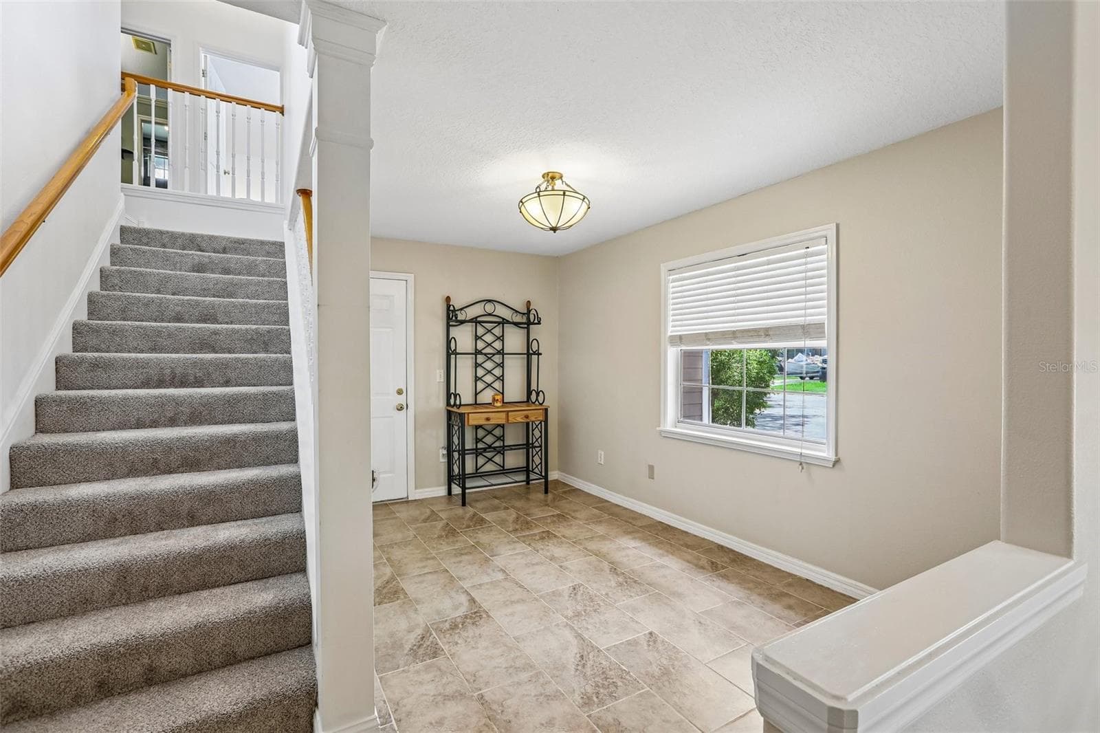 Second floor has 2 bedrooms, living room and full bathroom - 3131 N CANAL DR, PALM HARBOR
