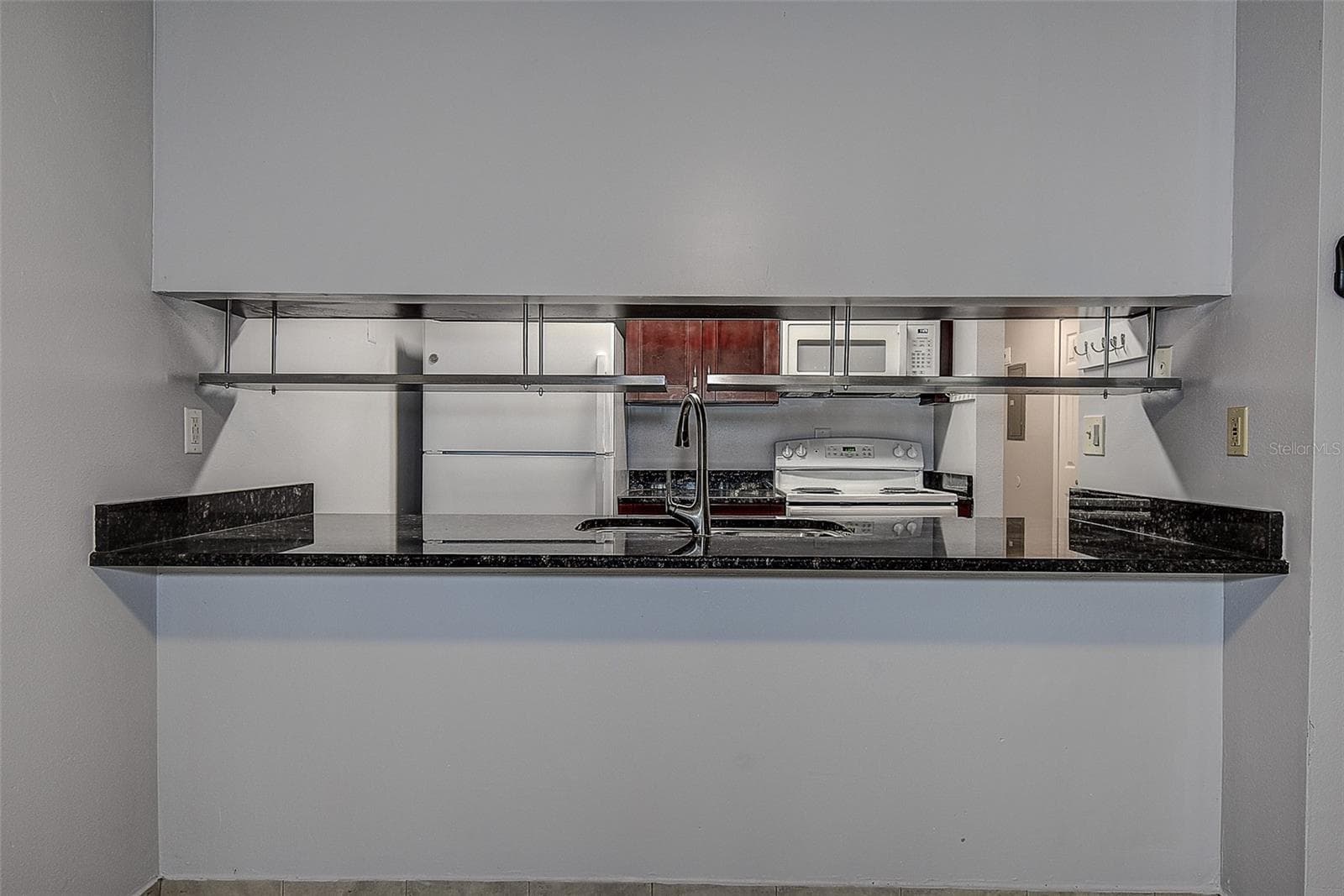View from Loving room to kitchen with breakfast bar - 10306 COUNCILS WAY, TEMPLE TERRACE