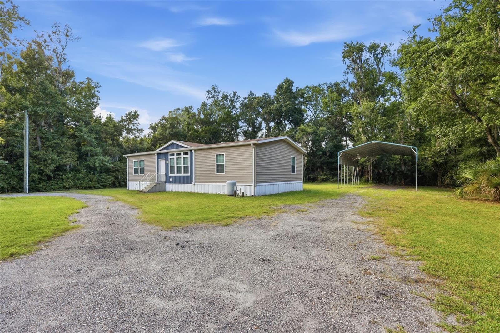 Covered RV/Boat/Etc storage to the right of home. - 2050 MINORCA RD, NEW SMYRNA BEACH