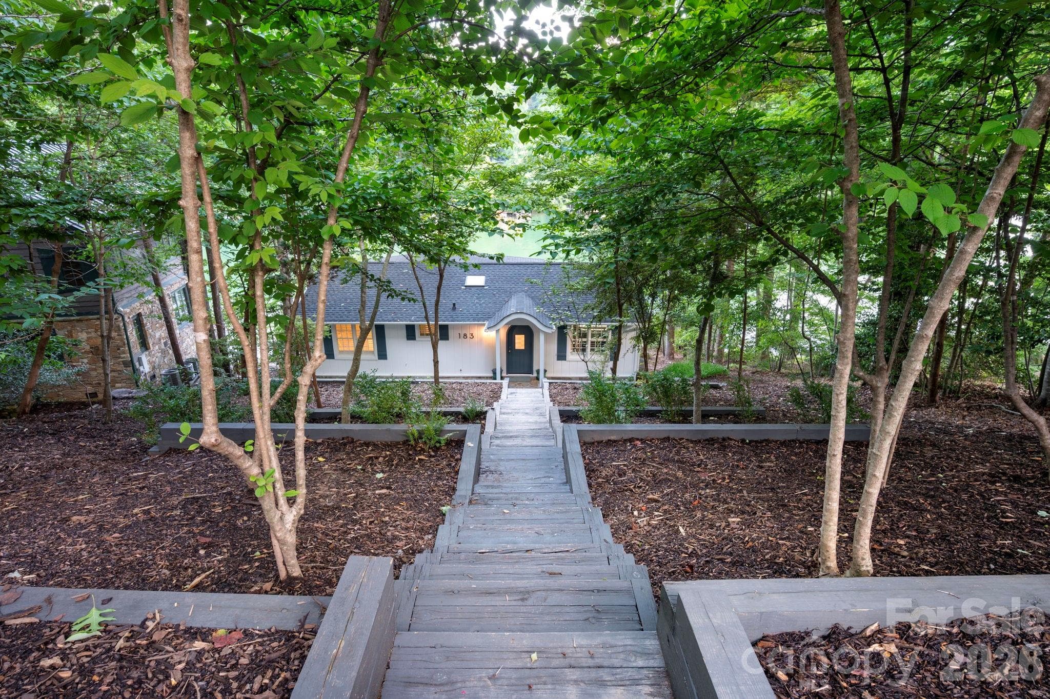 Terraced garden beds at entry - 183 Blarney Road, Lake Lure