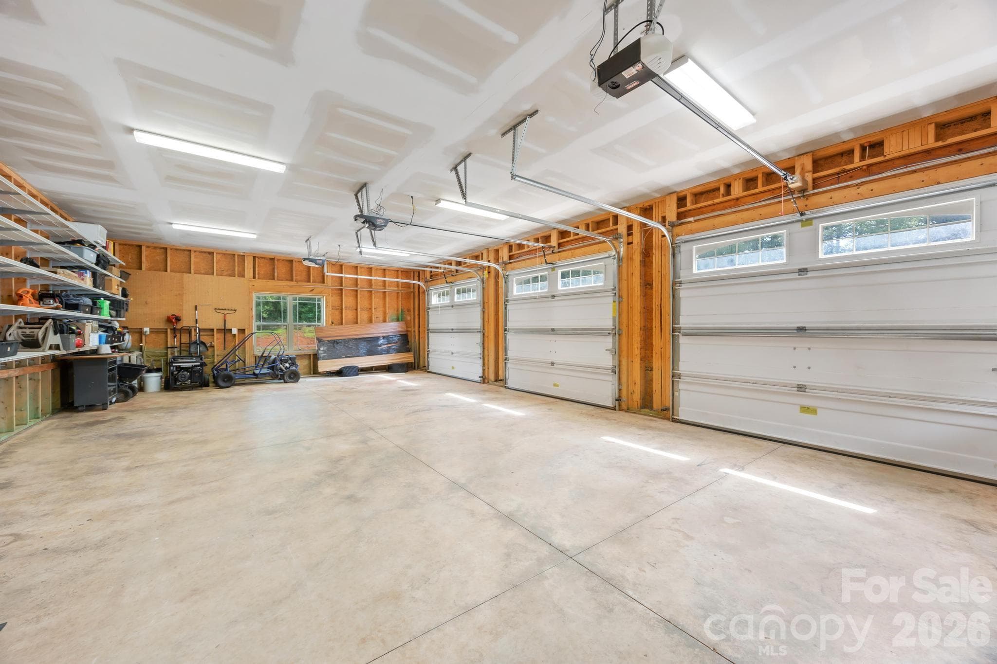 Three car garage with storage racks, additional storage not shown in picture - 6334 Long Island Road, Catawba