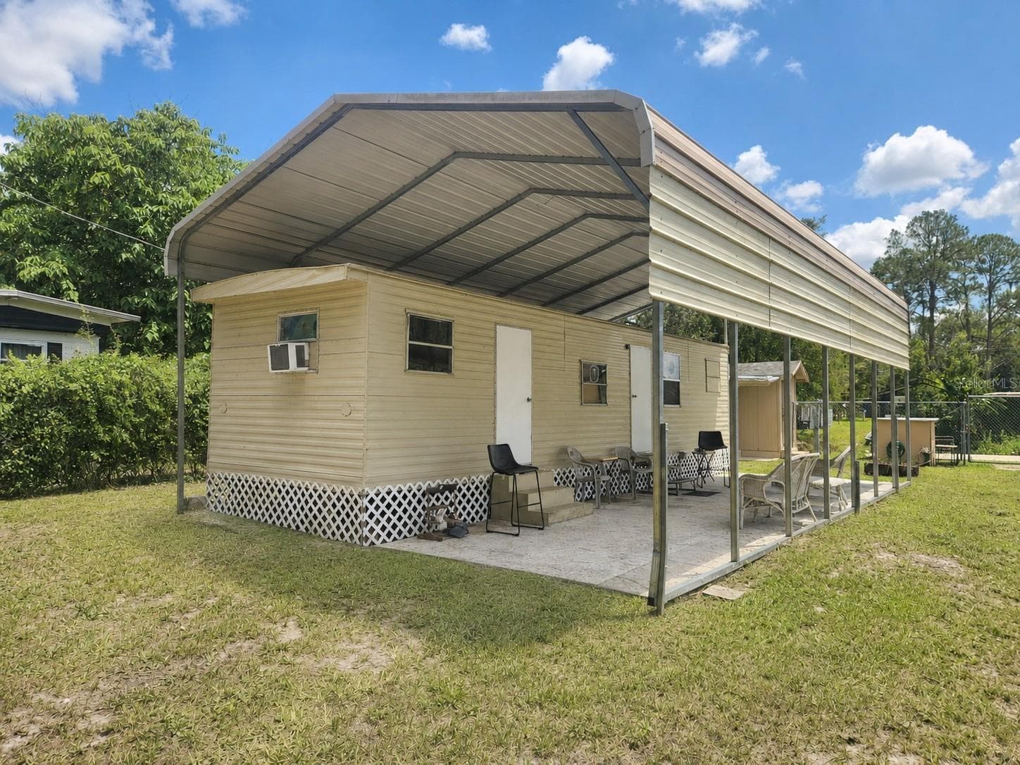 Metal Carport Over Home - 23824 NE 188TH PL, FORT MC COY