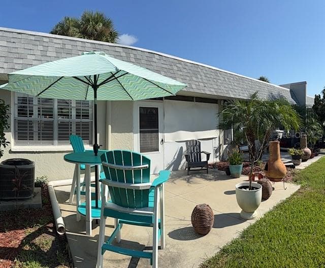 Your back patio has a large paved concrete area. Patio furniture is included. Amazing view! - 3444 TROPHY BLVD, NEW PORT RICHEY