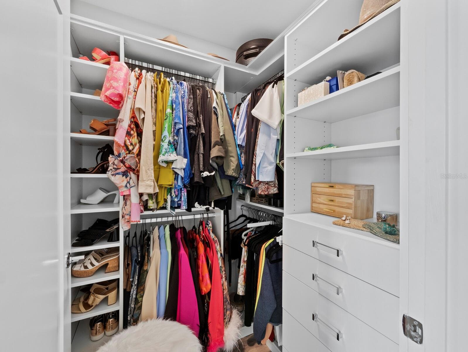California closet system in main bedroom walk in closet - 1709 N TAMIAMI TRL #418, SARASOTA