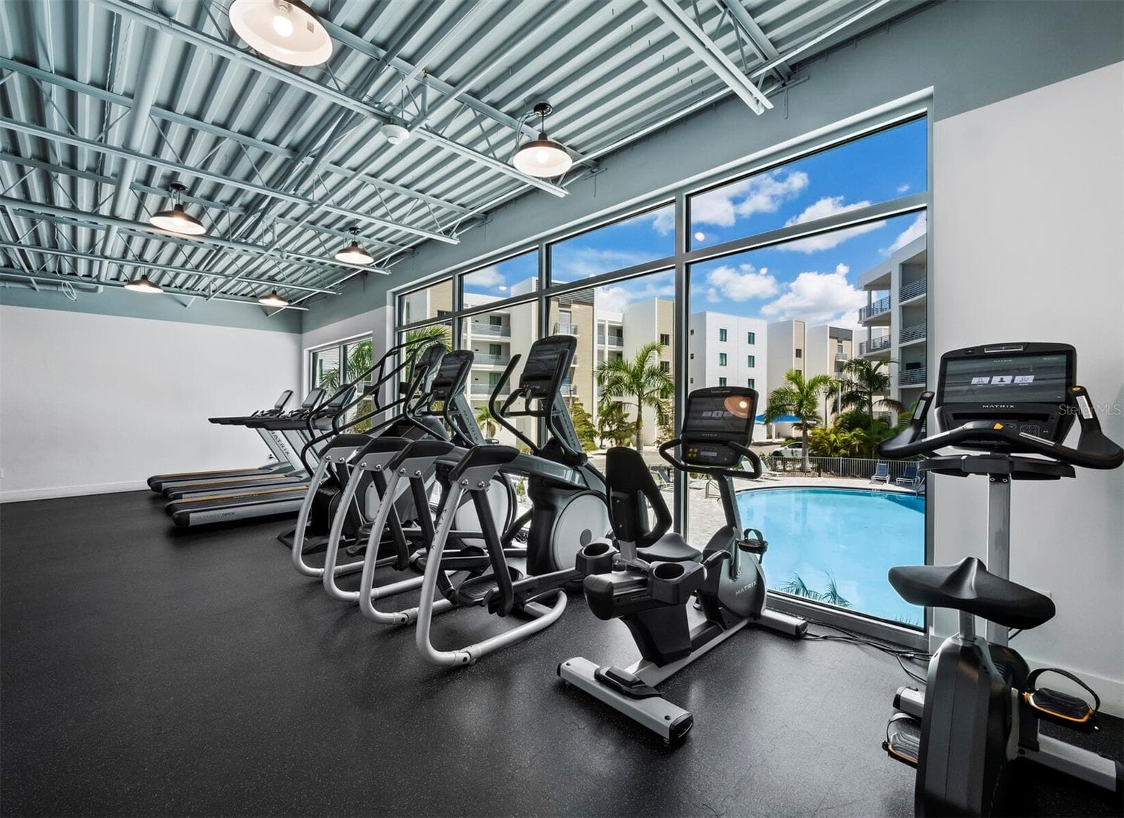 Well equipped fitness center overlooking pool - 1709 N TAMIAMI TRL #418, SARASOTA