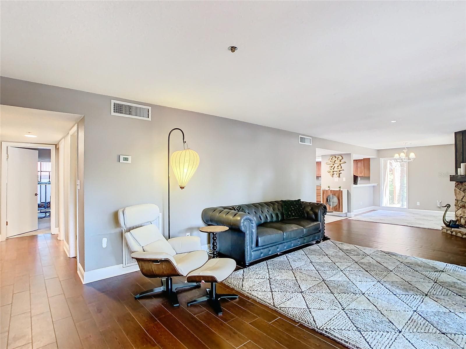Living area with view down hall of bedrooms - 976 E MICHIGAN ST #A, ORLANDO