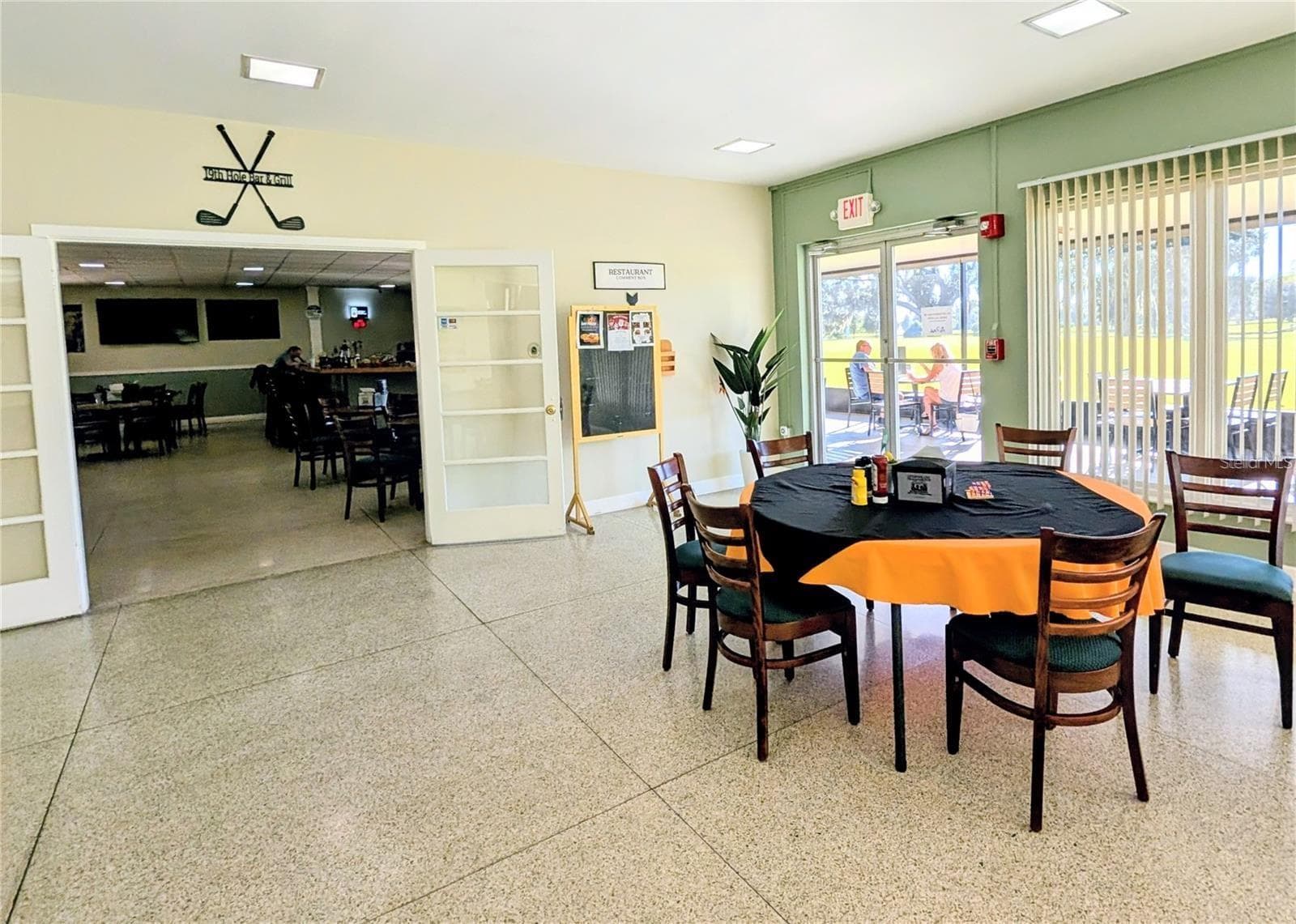 Lobby facing the golf course and 19th Hole Bar & Grill - 609 INDIAN LAKE DR, INDIAN LAKE ESTATES