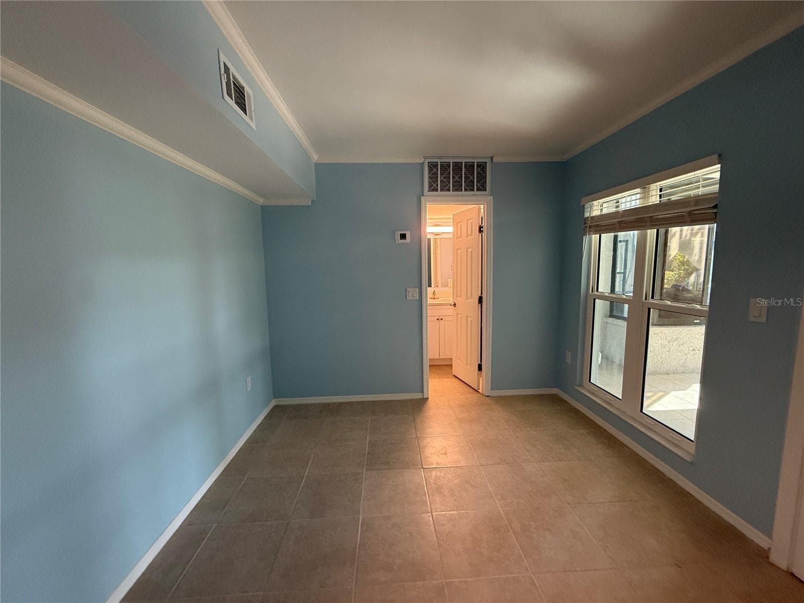 Bedroom with onsuite - 179 MEDALLION BLVD #D, MADEIRA BEACH