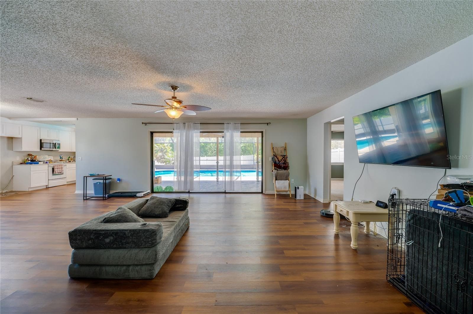 View from Front Entry all the way to the pool through the sliders! - 1040 W VILLAGE GREEN RD, DELAND