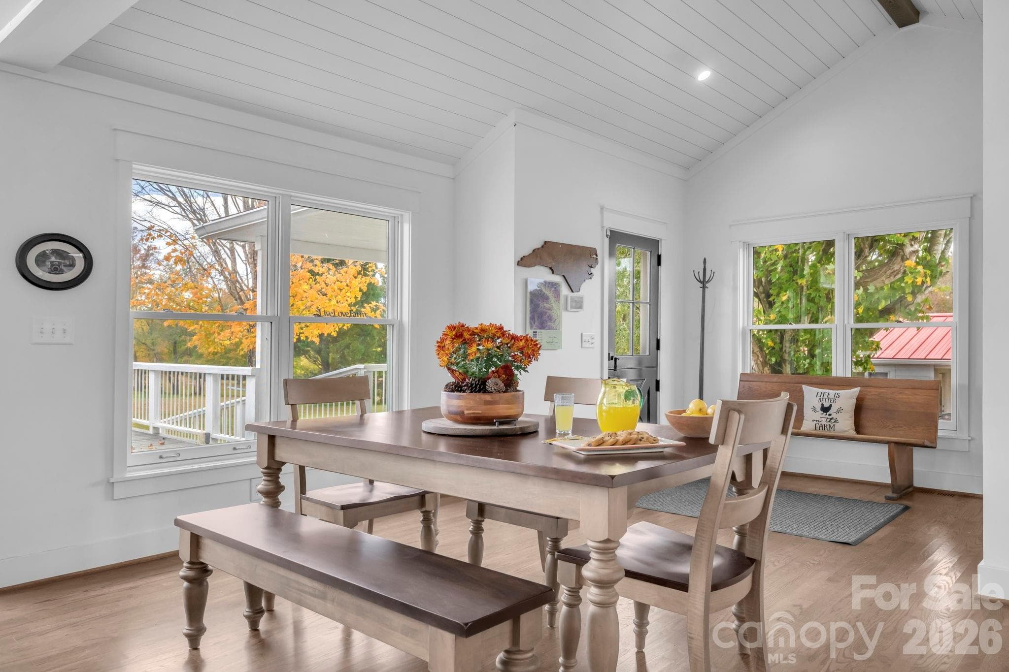 Open dining area adjacent to the kitchen & great room. Vaulted shiplap ceilings w/ exposed wood beams. - 1260 Beaver Island Trail Road, Walnut Cove