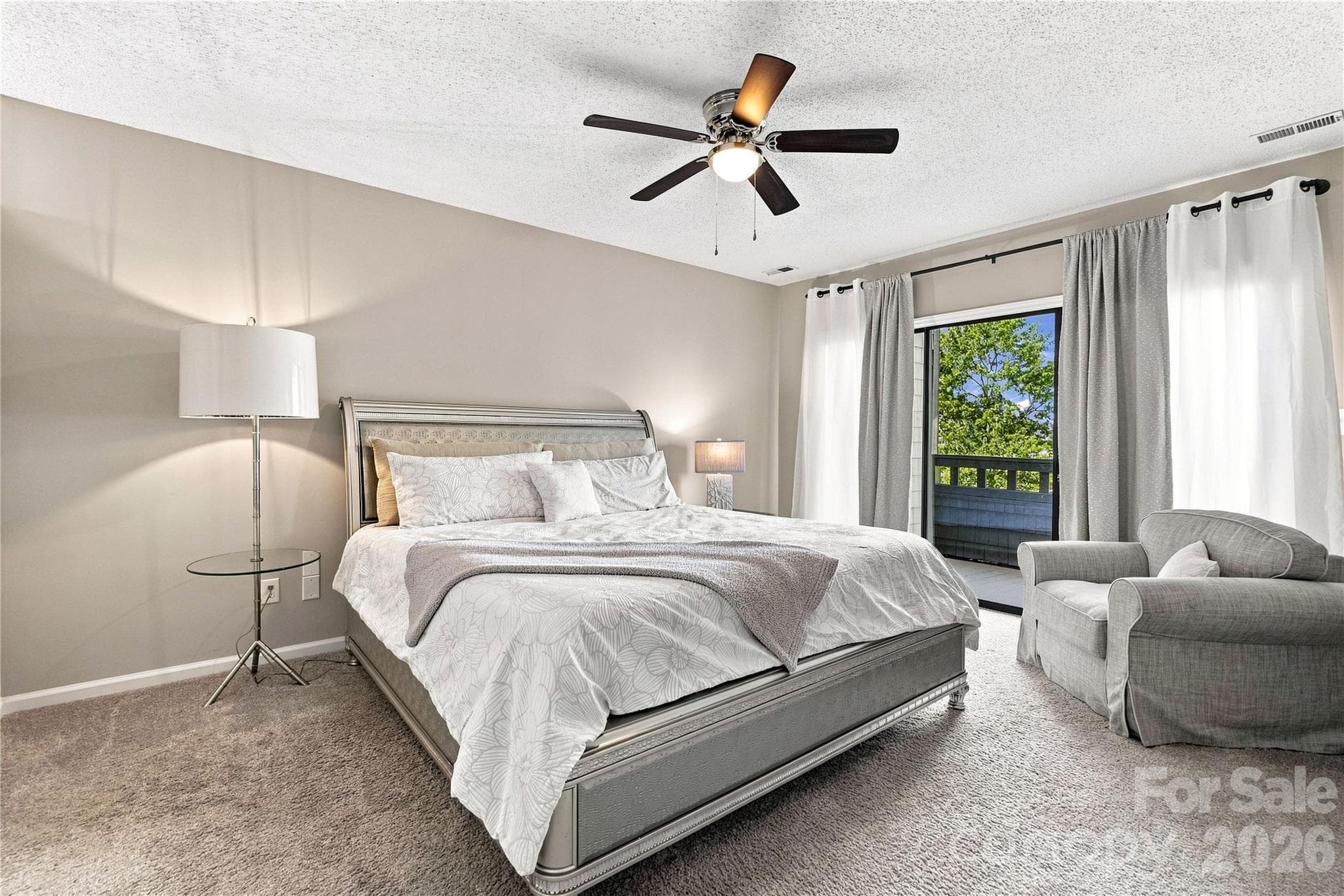 Primary bedroom with access to private balcony - 9031 J M Keynes Drive, Charlotte