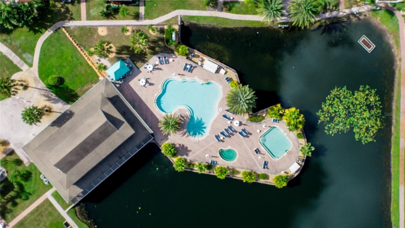 Aerial view of the Woods Clubhouse and pools. - 6757 AMANDA VISTA CIR, LAND O LAKES