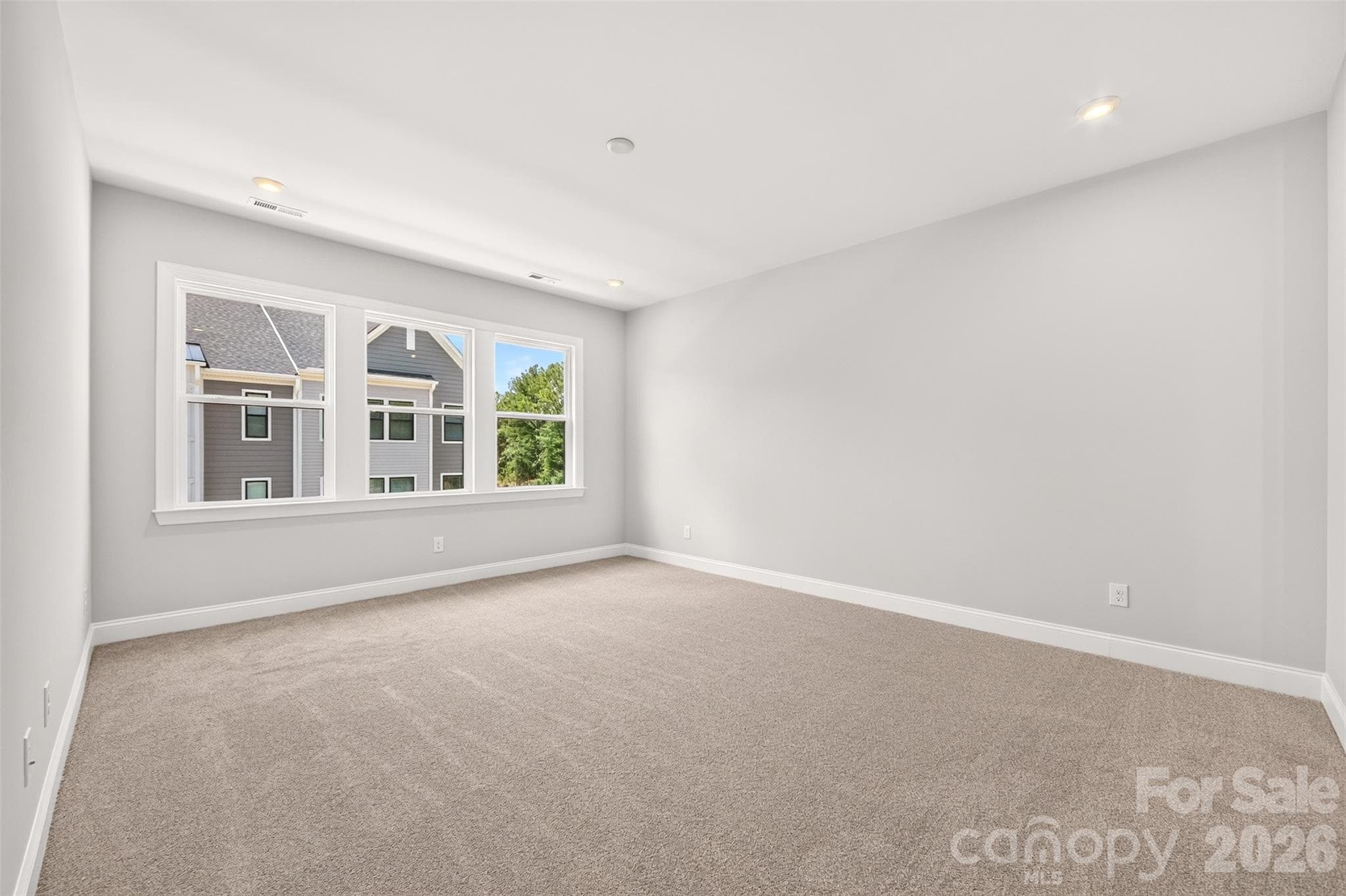 Light filled primary bedroom - 6008 Yellow Buckeye Drive, Charlotte