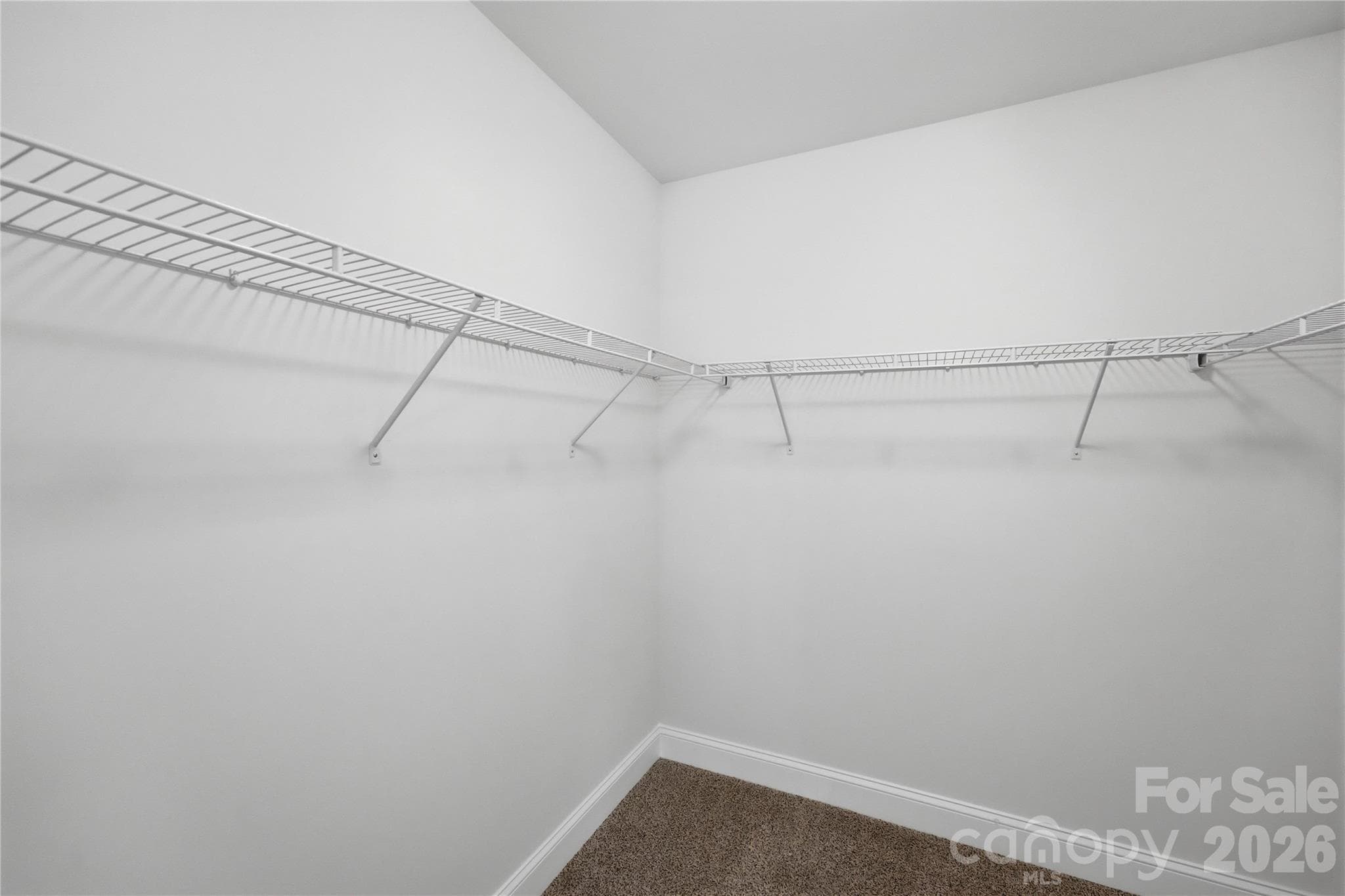 Walk-in closet in primary bedroom - 14133 Woodhurst Lane, Mint Hill
