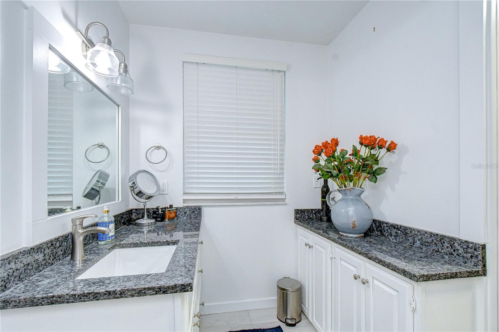 Beautifully remodeled bath features dual vanities and a walk-in shower - 901 WOODVIEW DR, BRANDON
