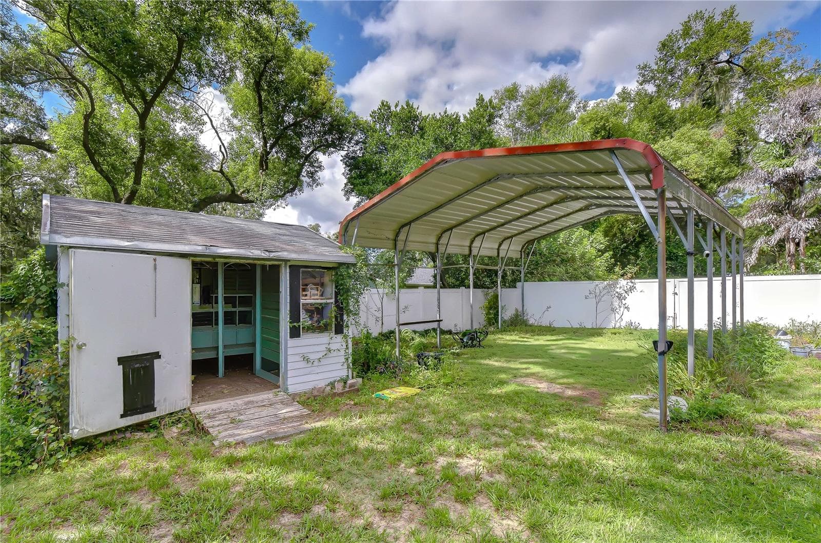 Convenient storage shed provides space for tools and outdoor equipment - 901 WOODVIEW DR, BRANDON