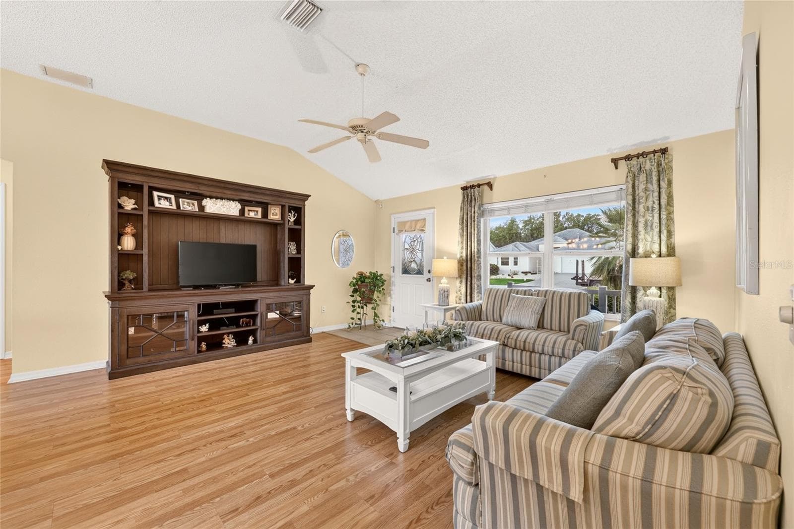 Living Room with Vaulted Ceiling - 16947 SE 93RD CUTHBERT CIR, THE VILLAGES