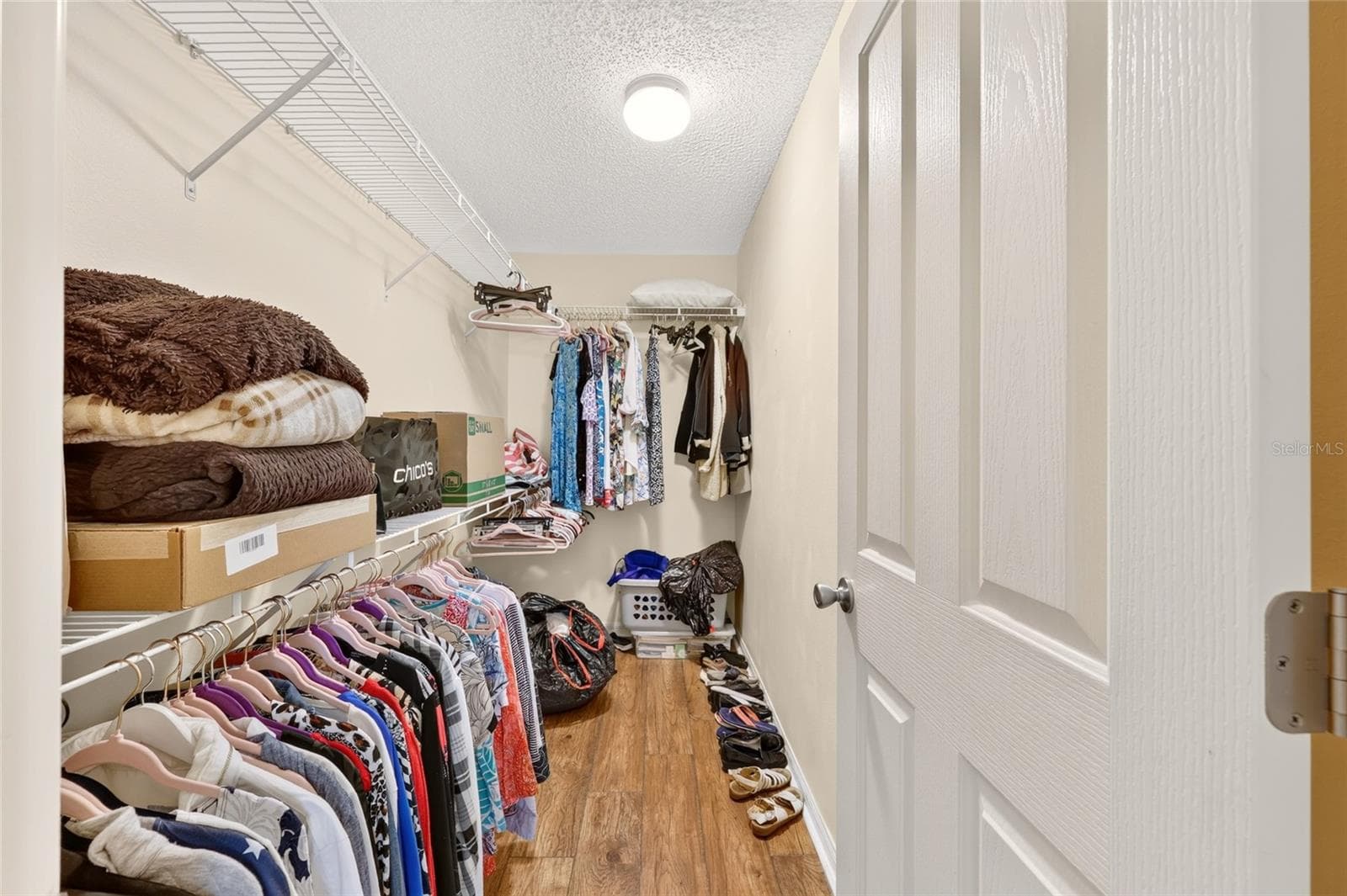 Walk-in Closet in Primary Bedroom - 16947 SE 93RD CUTHBERT CIR, THE VILLAGES