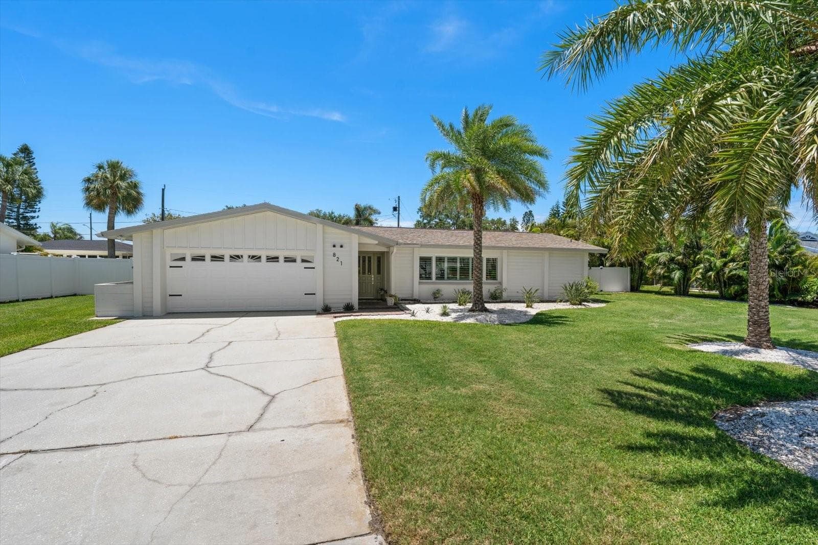 Large driveway, and lawns just waiting for someone to play on. - 821 JACARANDA DR, LARGO