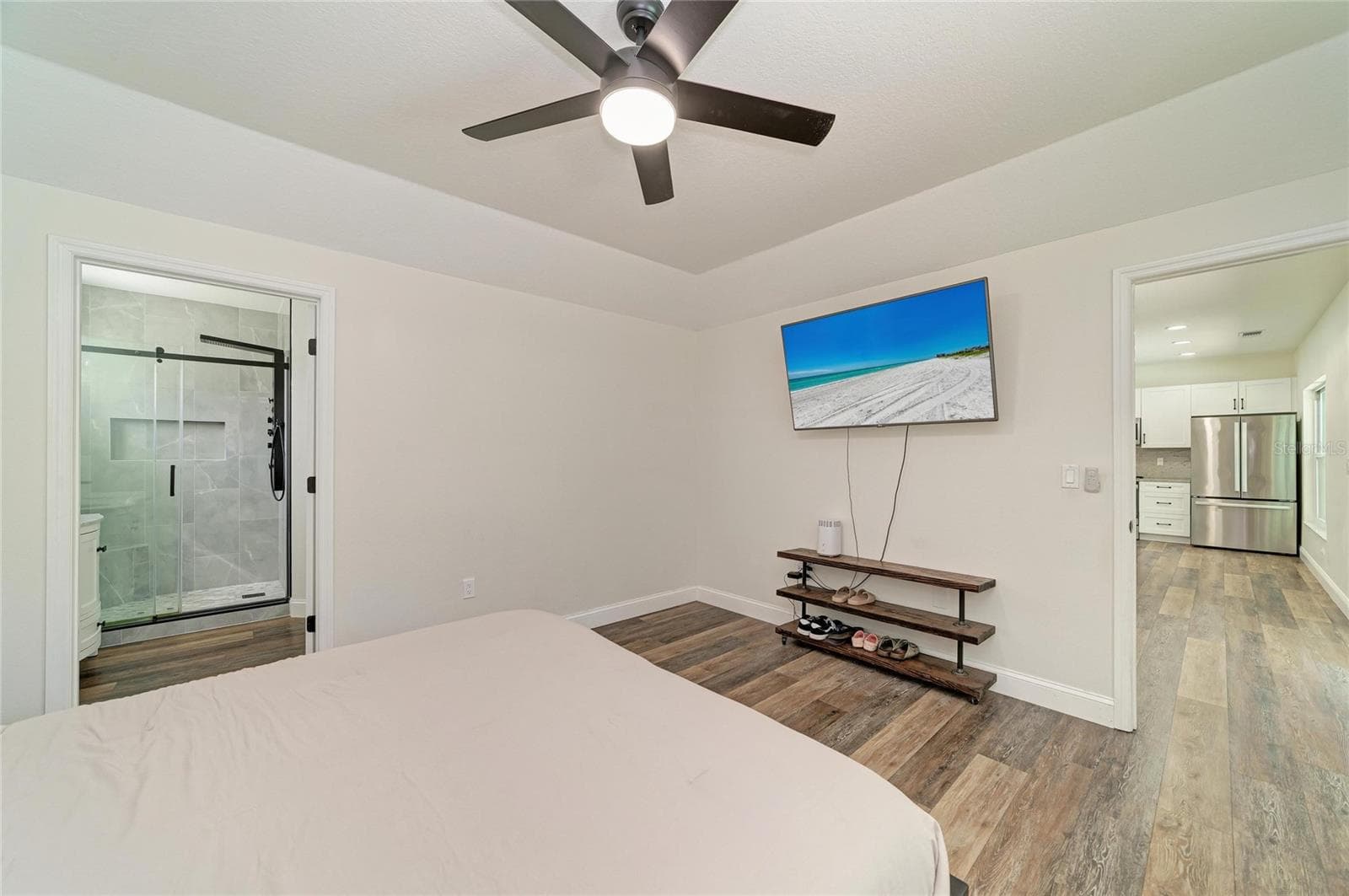 Primary bedroom is on first floor with ensuite bathroom and walk-in closet. - 3220 37TH TER E, BRADENTON