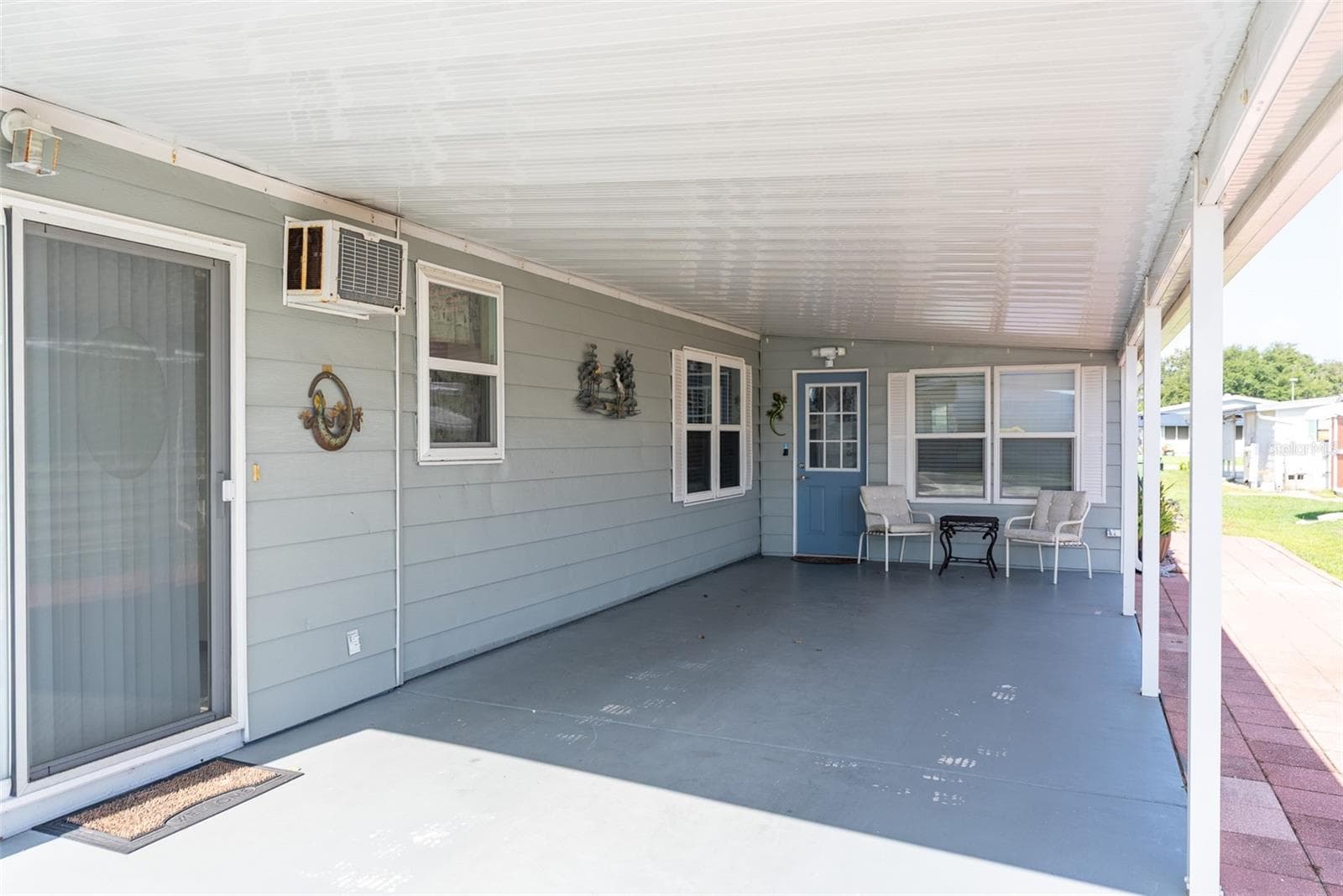 LARGE COVERED DRIVEWAY - 6703 CANTERBURY DR NE, WINTER HAVEN