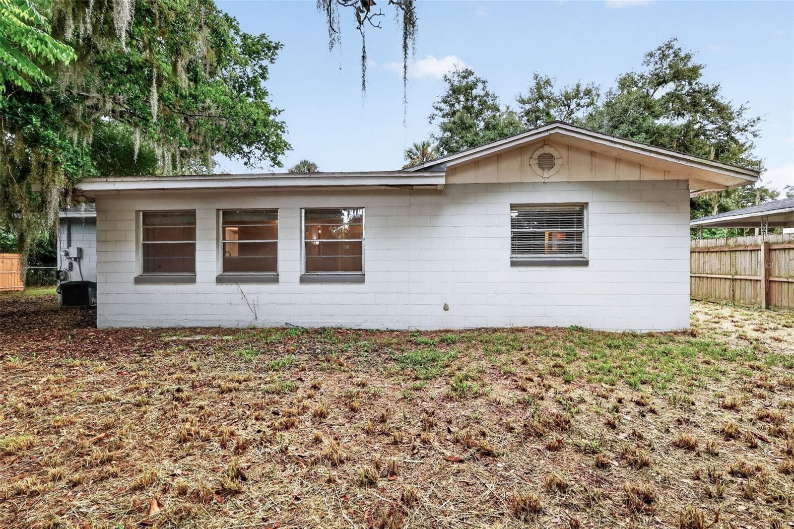 Fully Fenced Back Yard With Room for Pets, Gardening, and Simple Outdoor Enjoyment - 1305 ORANGE AVE, TAVARES