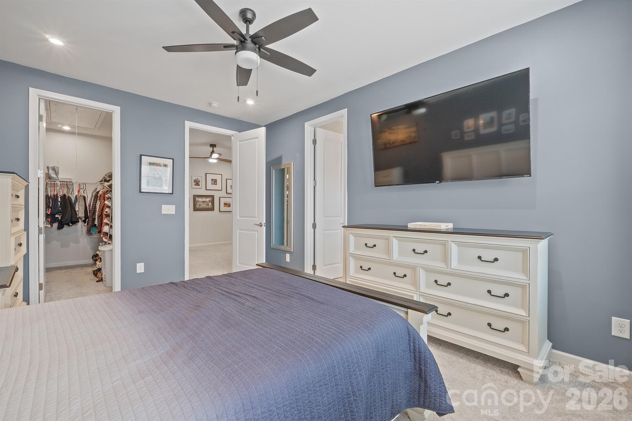 Primary Bedroom with ceiling fan and tv mount - 6161 Pierce Lane, Kannapolis