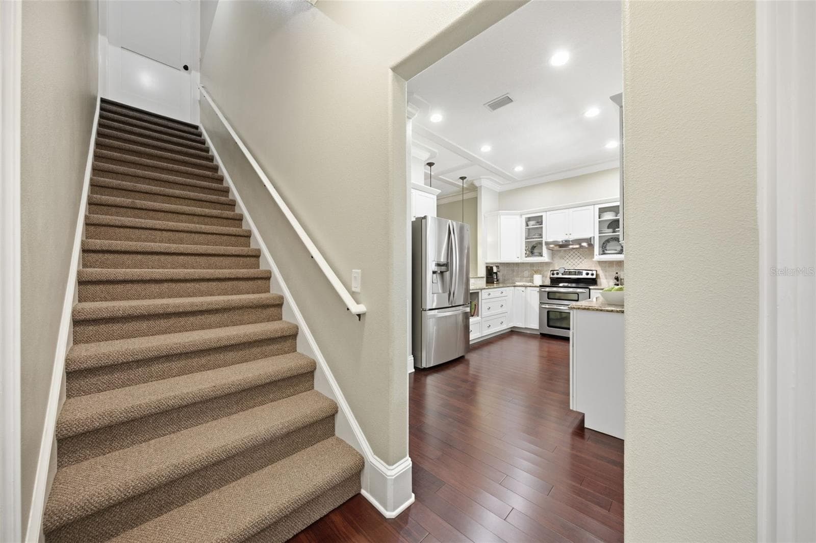 Garage entry way, stair to second level, entry to kitchen and laundry. - 1905 PINE ST, VALRICO