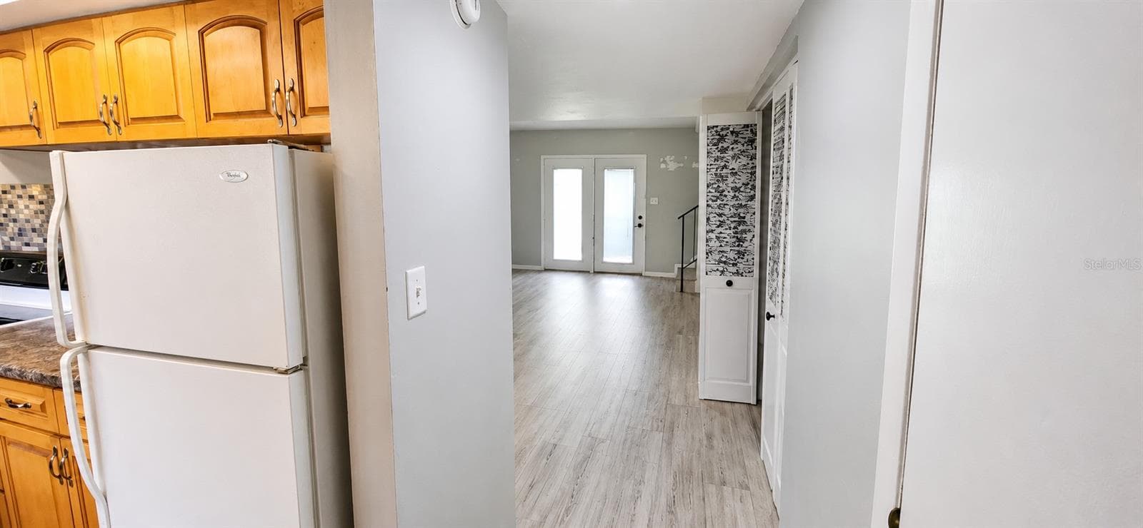 Foyer to view the bright french door - 2405 SE 16TH AVE #B, OCALA