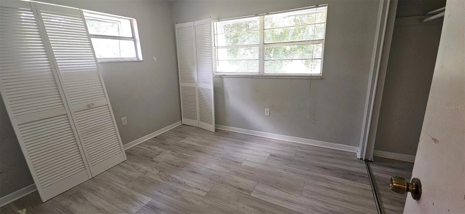 Rear bedroom with an abundance of natural light - 2405 SE 16TH AVE #B, OCALA