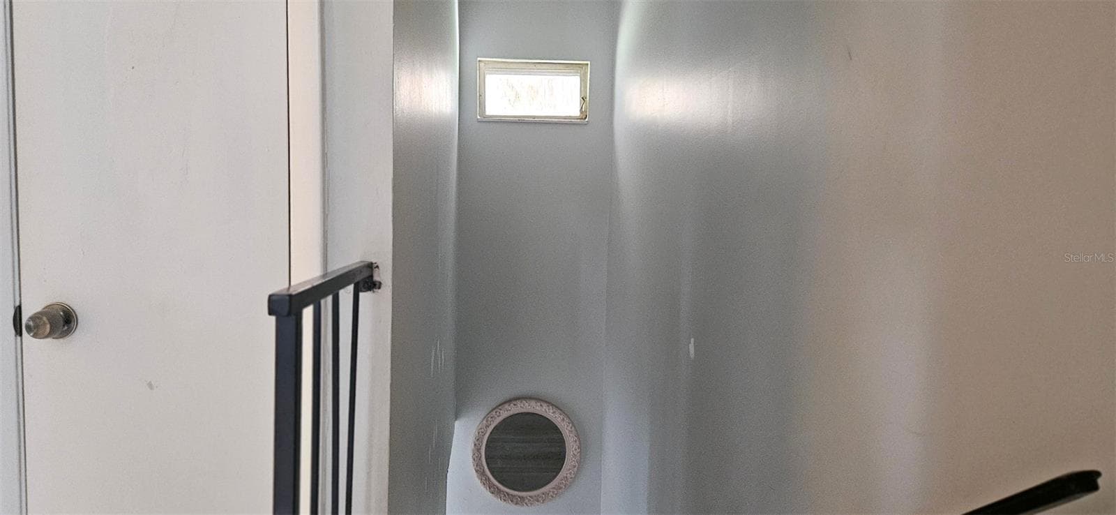 Natural light casts over the stairwell - 2405 SE 16TH AVE #B, OCALA