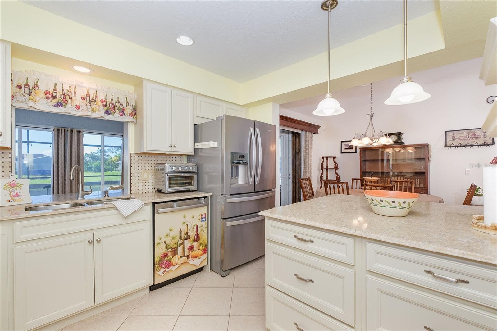 Pool & canal view from kitchen - 9296 ARRID CIR, PORT CHARLOTTE