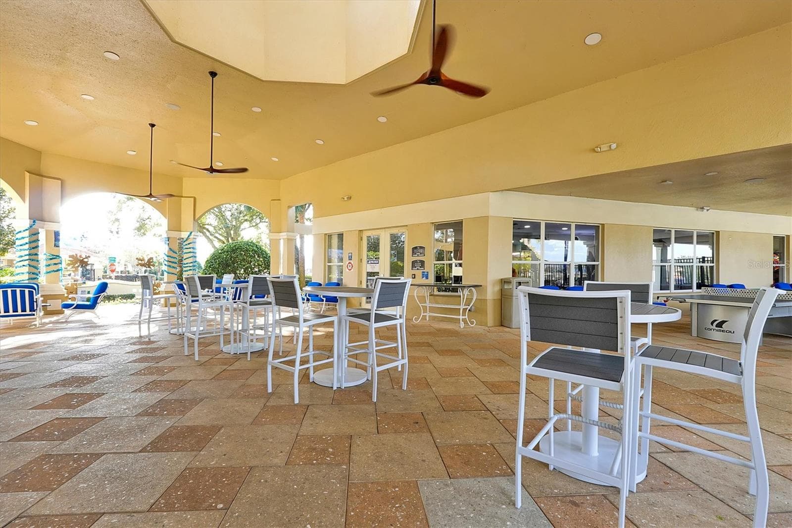 Enjoy the cool breeze in the shade through the walkway by the restaurant and pool. - 2778 ALMATON LOOP #204, KISSIMMEE