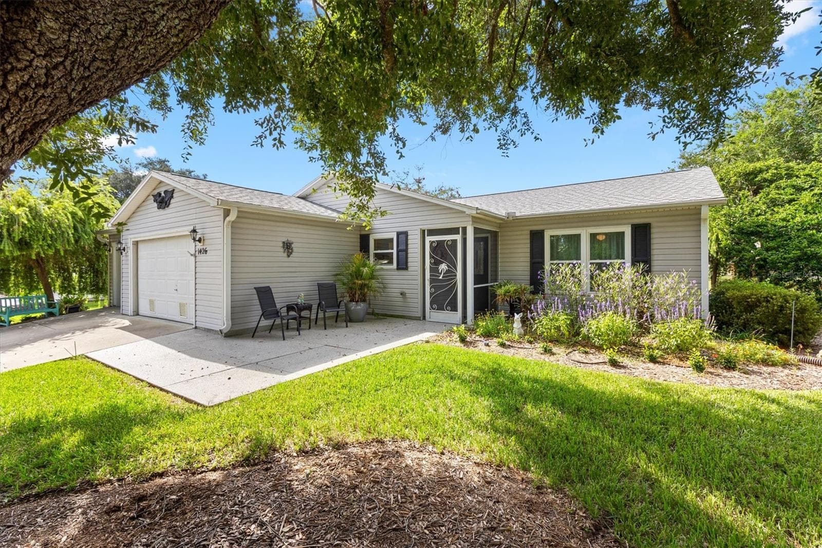 HOME WITH 2 1/2 GARAGE AND PATIO - 1426 JUAREZ PL, THE VILLAGES