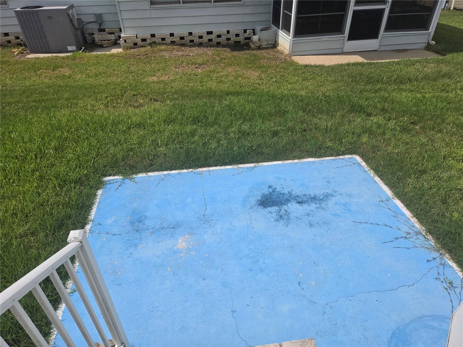 Patio out back door - 213 YORK COTTAGE DR, HAINES CITY