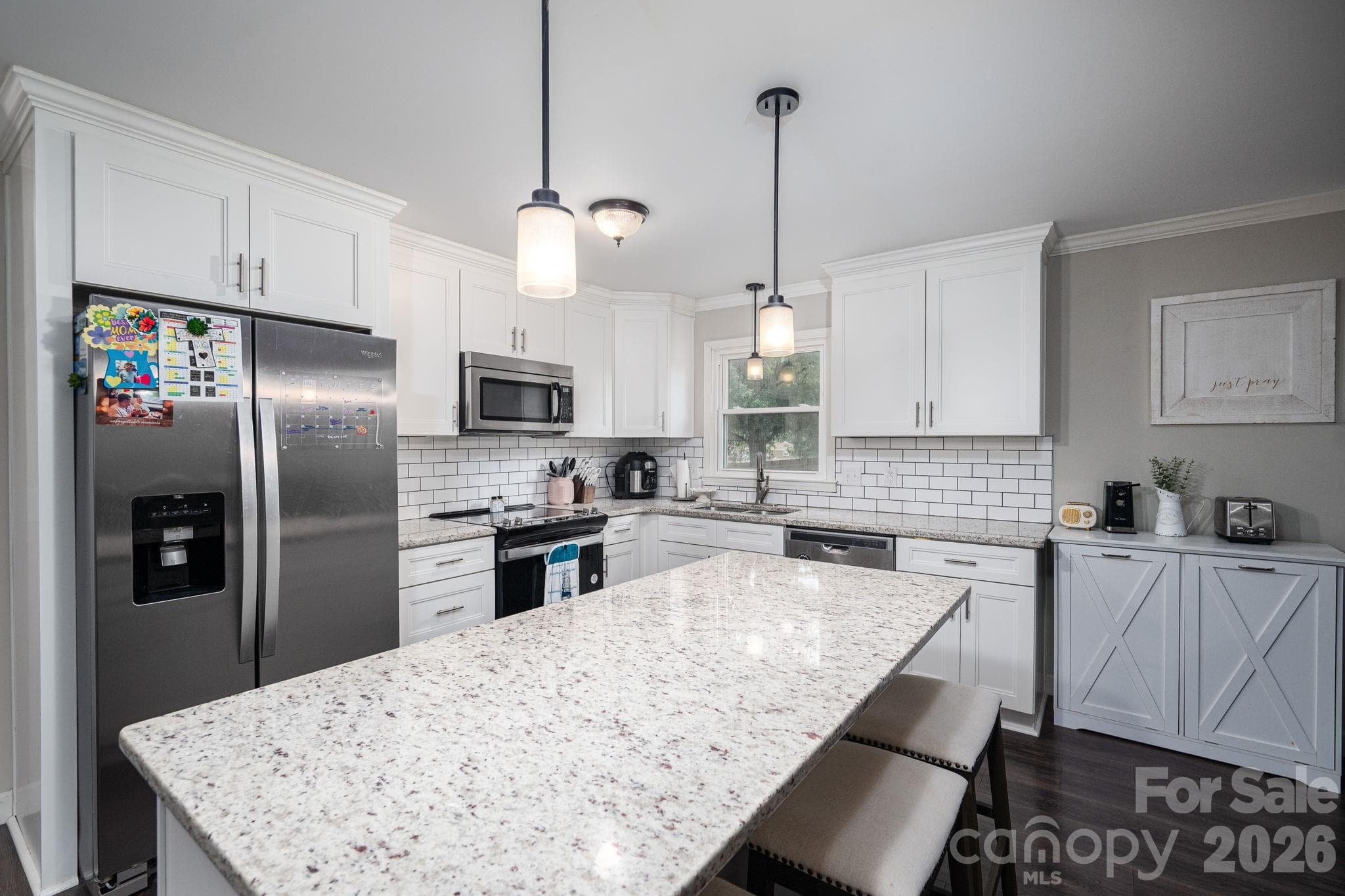 Kitchen with eat-in island. Appliances remain. - 1718 Woolie Road, Lincolnton