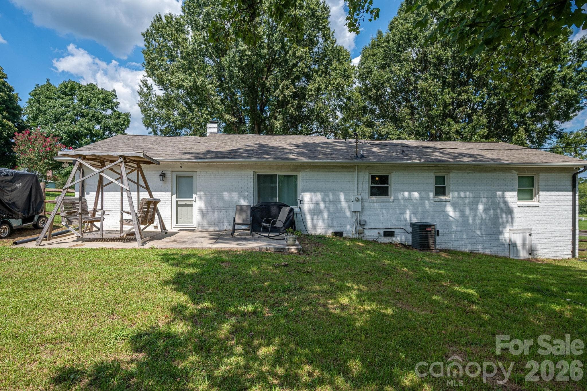 Back of the house with patio - 1718 Woolie Road, Lincolnton