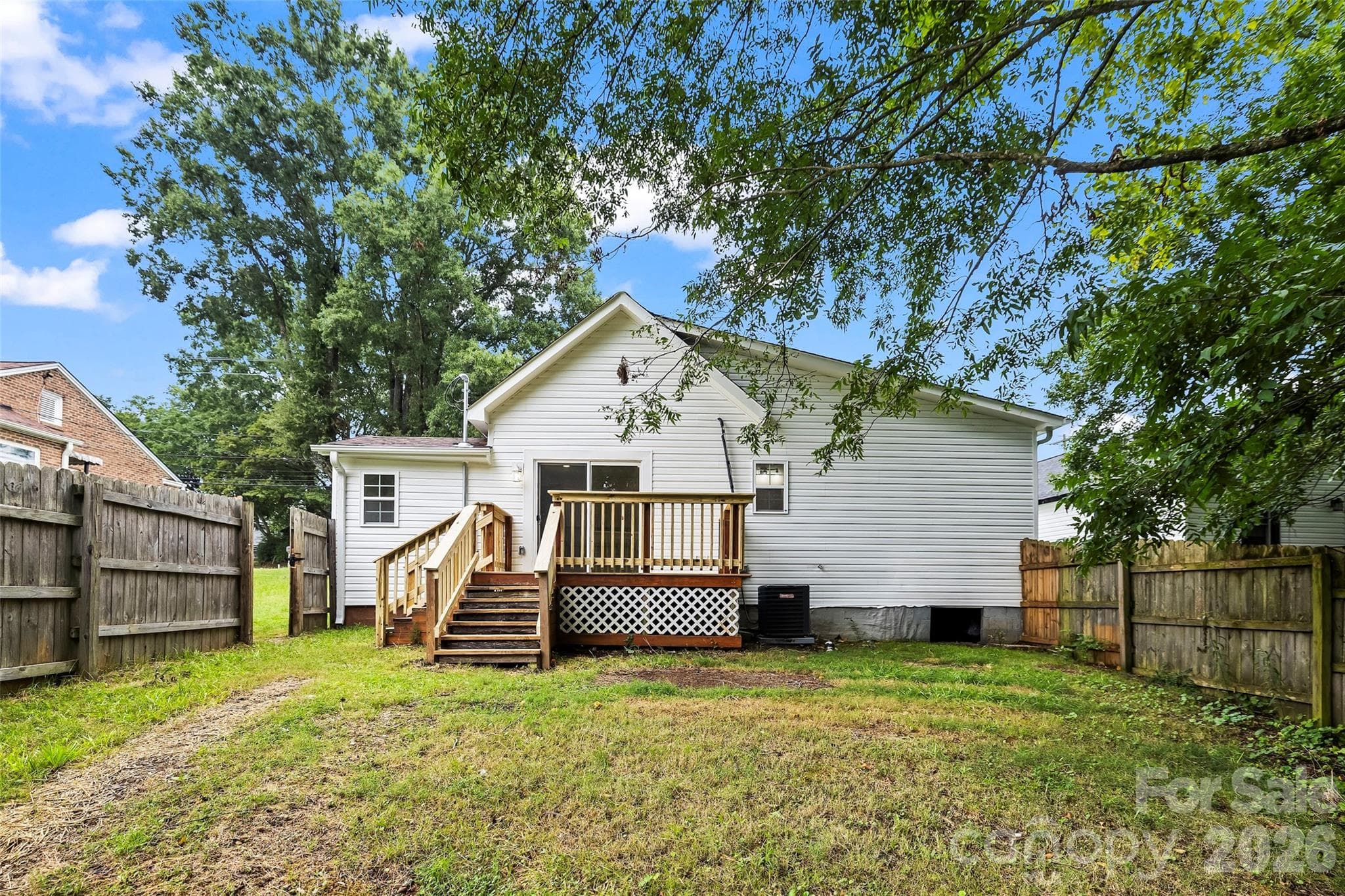 back of house, deck and fenced backyard - 605 Kings Mountain Street, Clover